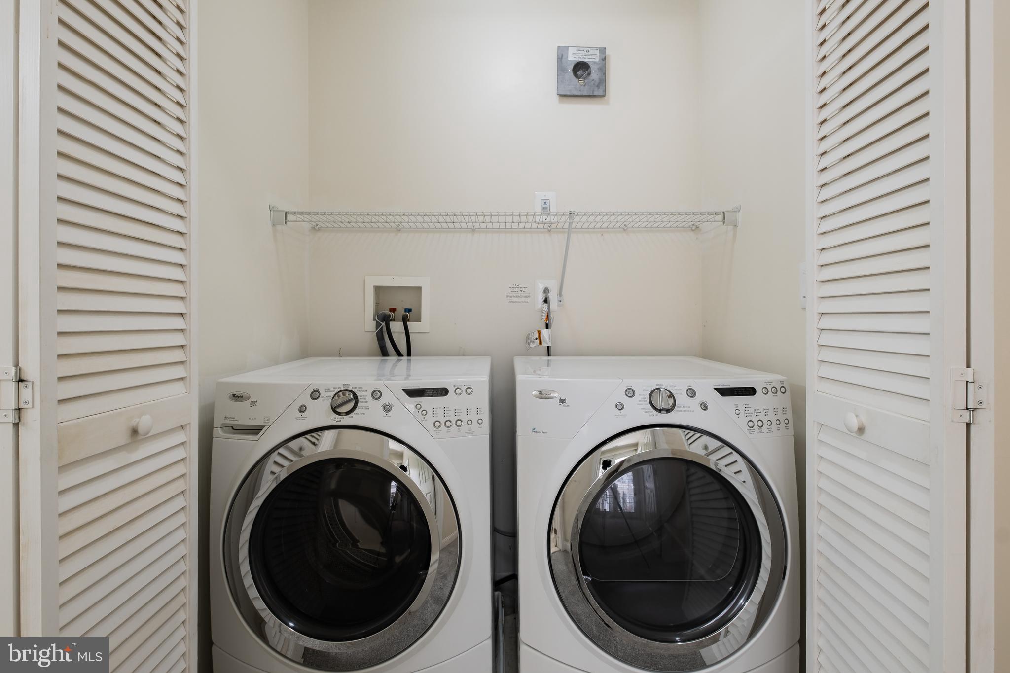 201 Commodore Court Philadelphia, PA 19146 - Photo 39 of 61 a view of a hallway with washer and dryer