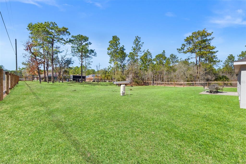 15335 Fleetwood Road Weeki Wachee, FL 34614 - Photo 35 of 40 a front view of a house with a yard