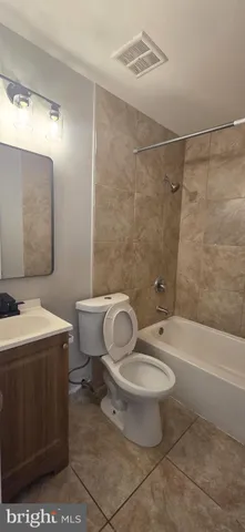 a bathroom with a toilet and a bathtub