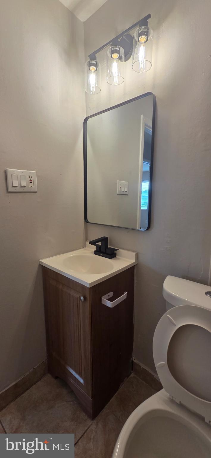 15 Lawrence Court Sicklerville, NJ 08081 - Photo 22 of 33 a bathroom with a toilet sink and mirror
