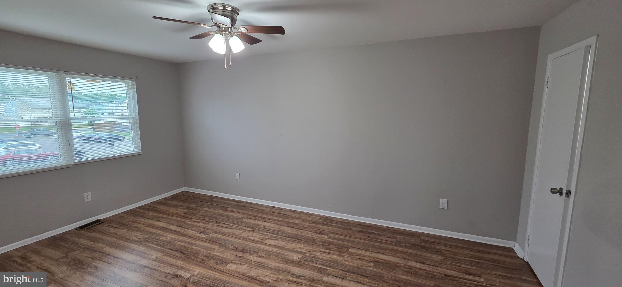 15 Lawrence Court Sicklerville, NJ 08081 - Photo 28 of 33 wooden floor in an empty room with a window