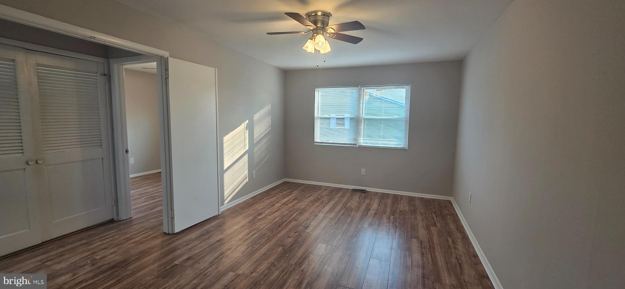 15 Lawrence Court Sicklerville, NJ 08081 - Photo 29 of 33 wooden floor in an empty room with a window
