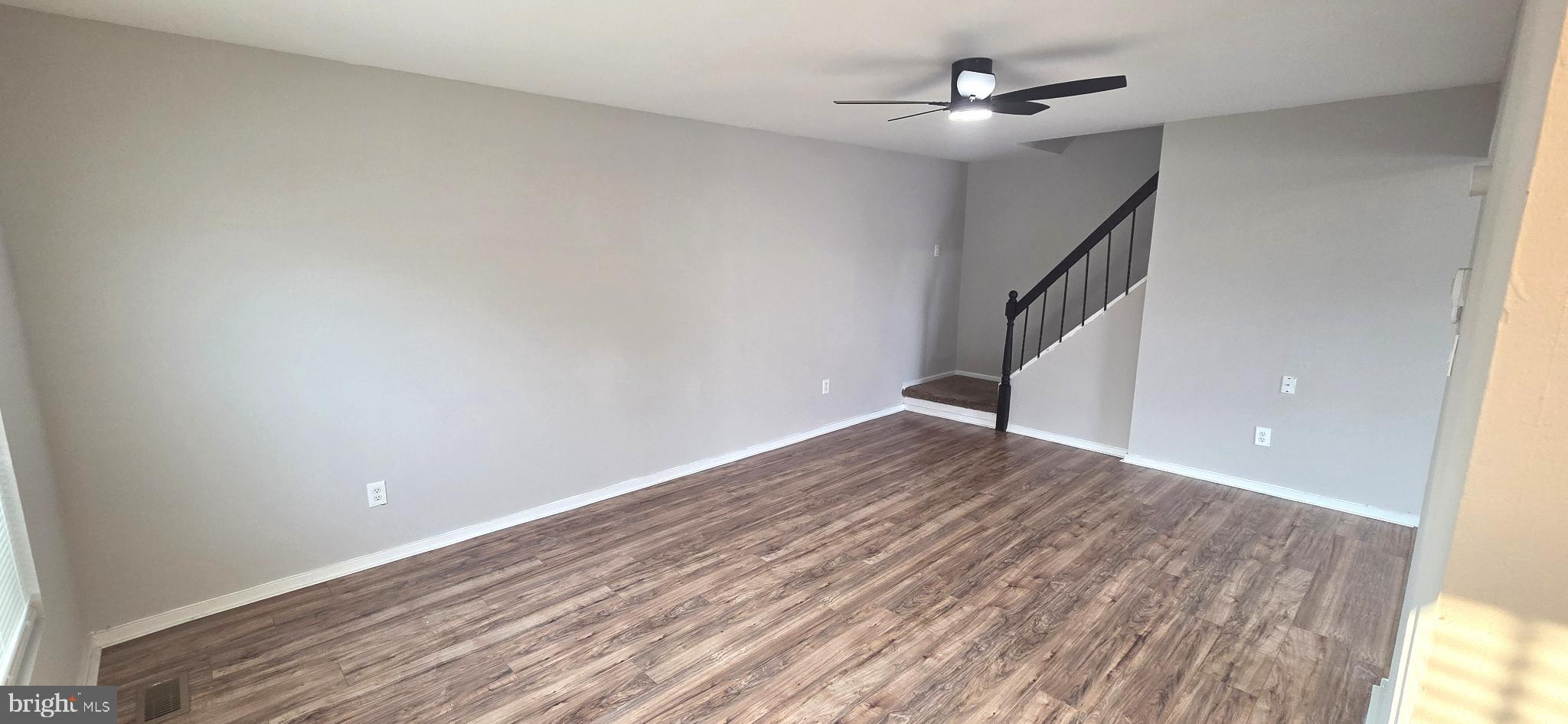 15 Lawrence Court Sicklerville, NJ 08081 - Photo 7 of 33 wooden floor in an empty room with a window