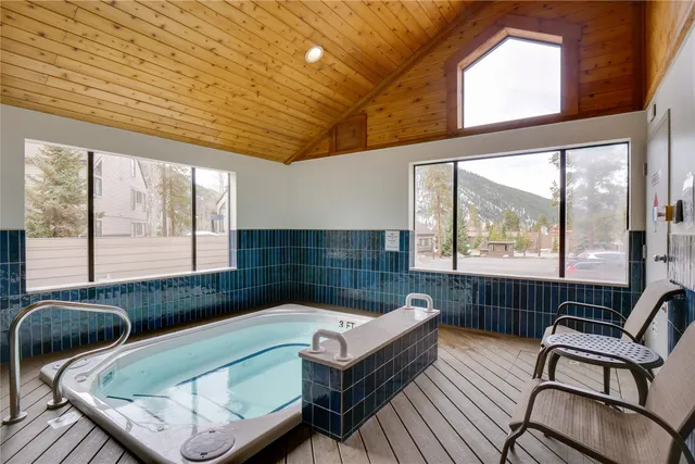 a bathroom with a tub sink and window