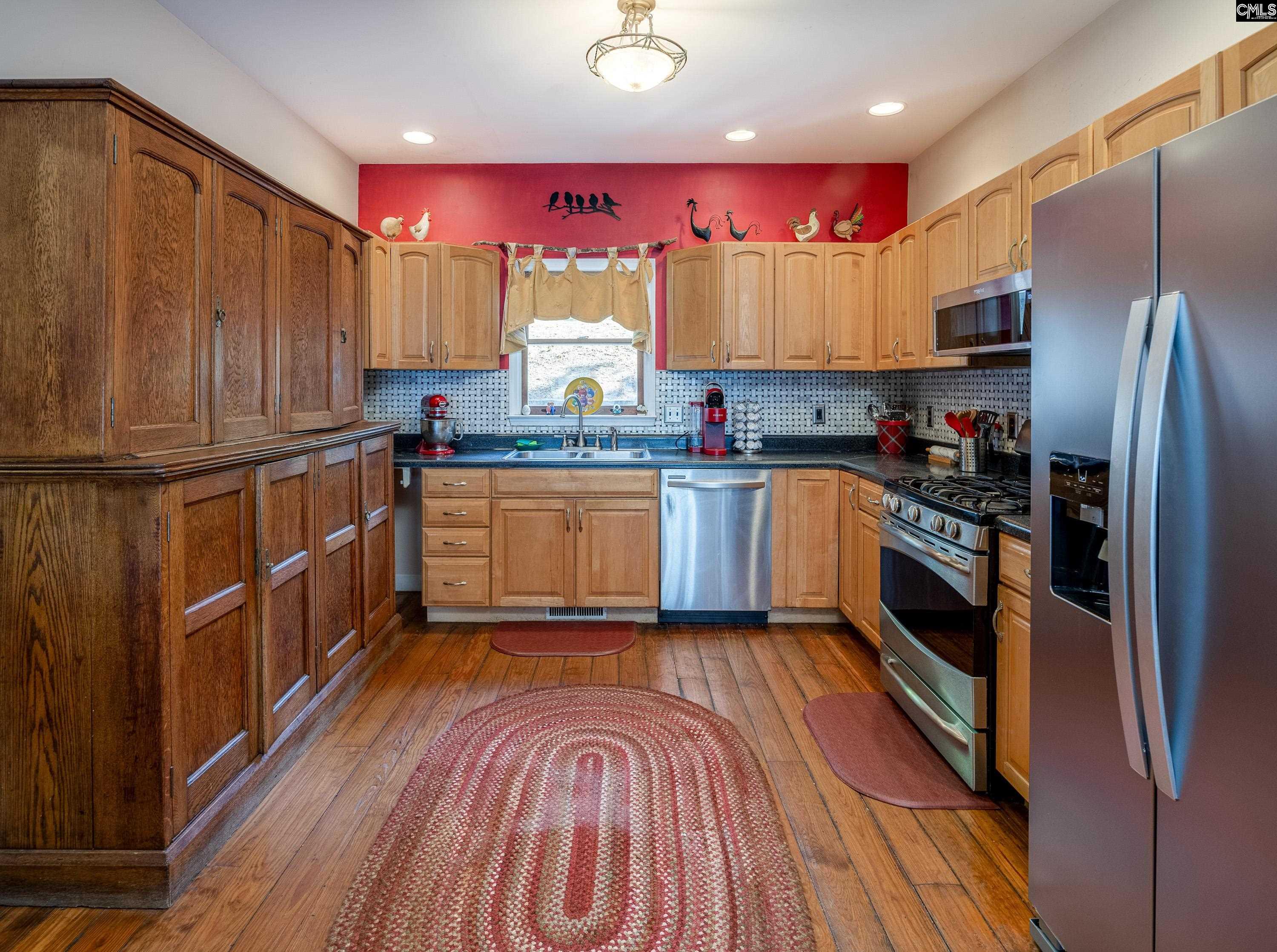2577 Harbor View Road Camden, SC 29020 - Photo 19 of 42 a kitchen with stainless steel appliances a sink wooden floor and window