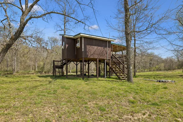 a front view of house with a yard