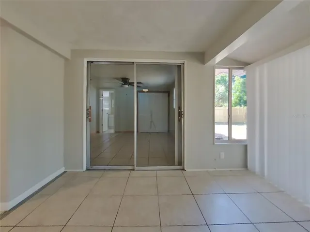 a view of a kitchen with white cabinets