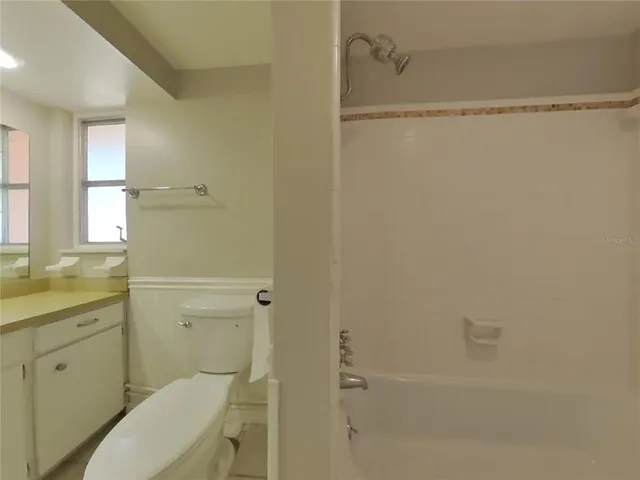 a view of a room that has a window in it