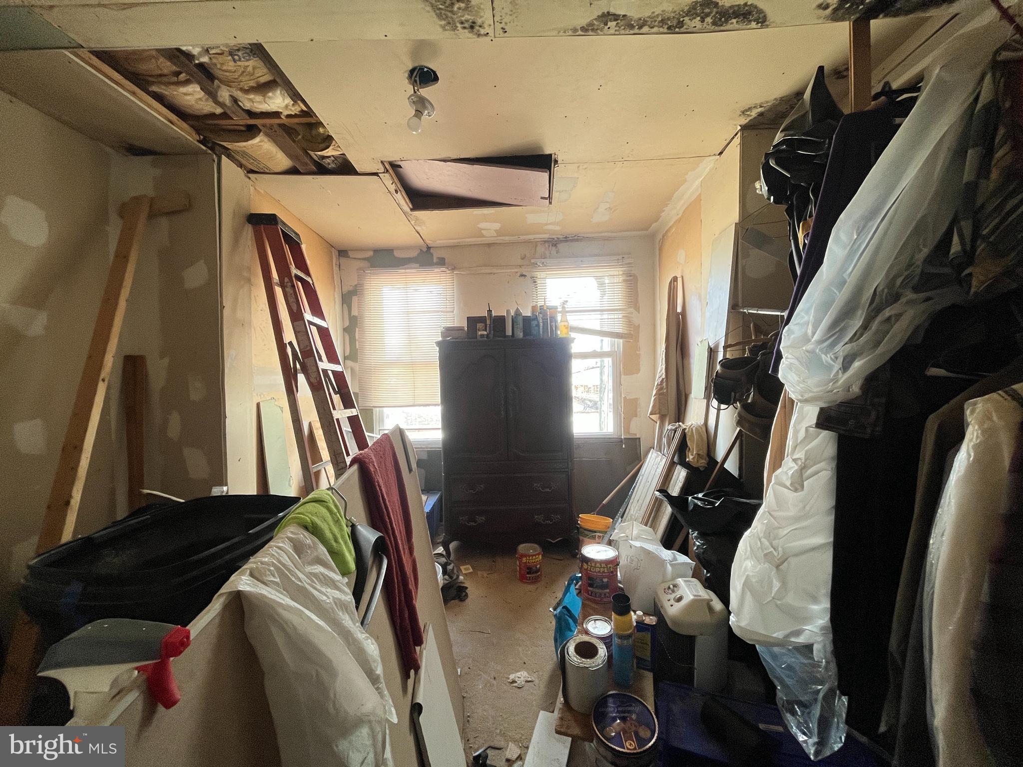 1508 Cliftview Avenue Baltimore, MD 21213 - Photo 12 of 18 a view of walk in closet with clothes and shoes