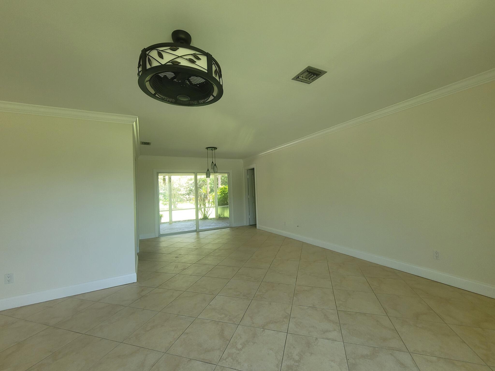 2913 Southeast Darien Road Port St. Lucie, FL 34952 - Photo 8 of 54 Living Room Back