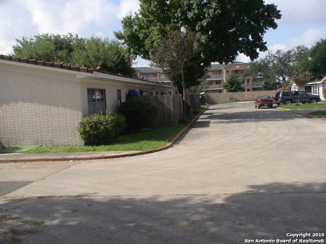 7923 Donore Place, Unit 12 San Antonio, TX 78229 - Photo 1 of 9 a view of street with parked cars