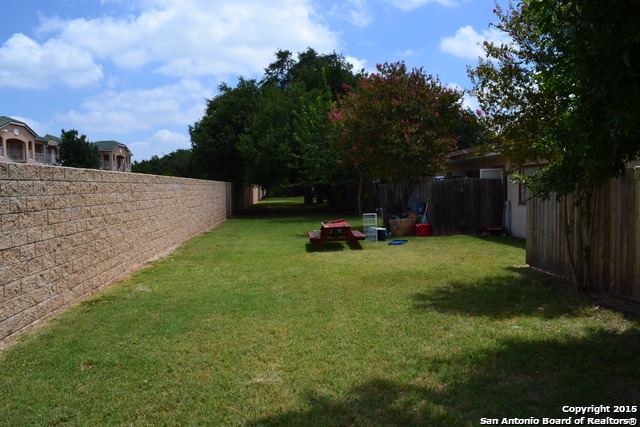 7923 Donore Place, Unit 12 San Antonio, TX 78229 - Photo 9 of 9 a view of a backyard with sitting area