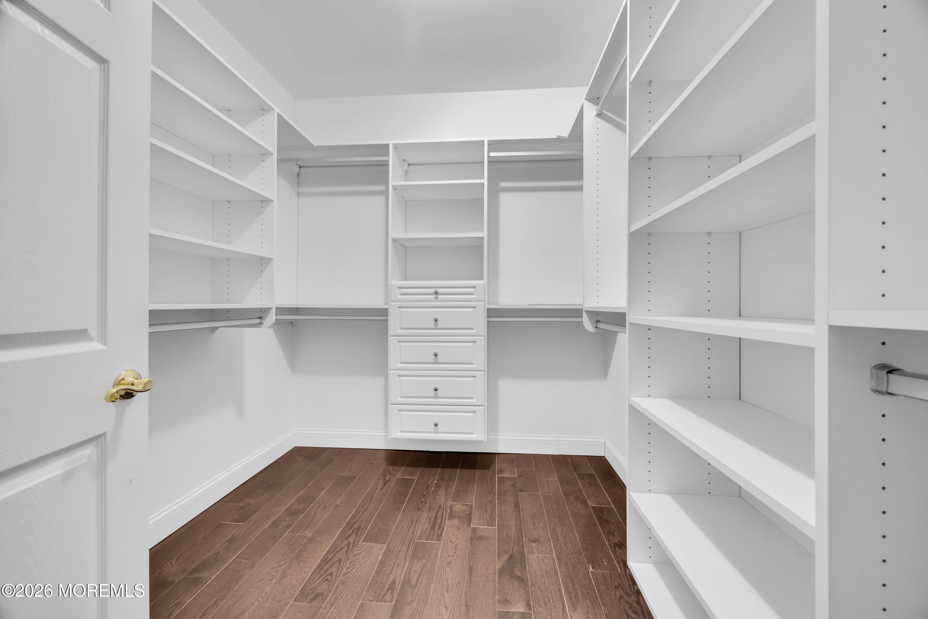 540 Cranbury Road, Unit 219 East Brunswick, NJ 08816 - Photo 16 of 39 a view of walk in closet with empty racks