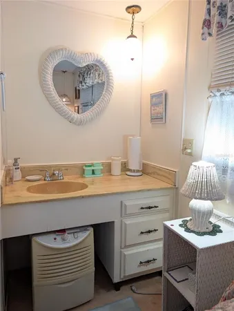 a living room with furniture a lamp a rug and a window