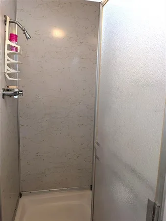 a living room with furniture a lamp and a chandelier