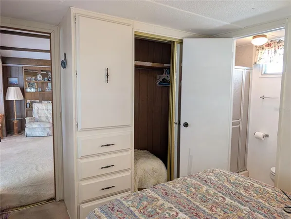 a kitchen with granite countertop a sink cabinets stainless steel appliances and a counter space