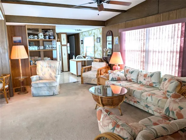 a view of a dining room with furniture and window