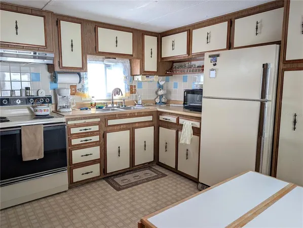 a bedroom with bed and a couch