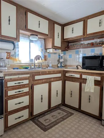 a bedroom with two beds and a flat screen tv