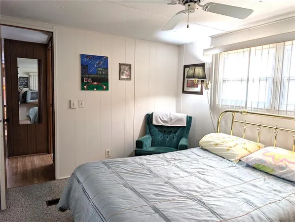 a dining area with stainless steel appliances kitchen island granite countertop a dining table chairs and a oven