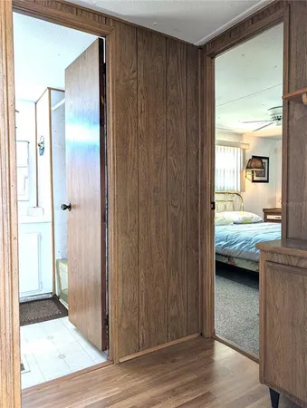 a view of a workspace with furniture and a bookshelf