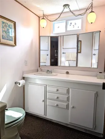 a kitchen with appliances cabinets and a table