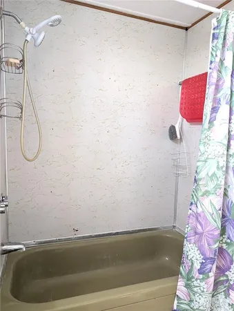 a view of a dining room with furniture wooden floor and chandelier
