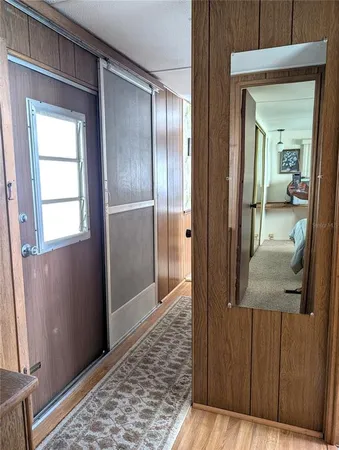 a view of roof deck with dining table and chairs