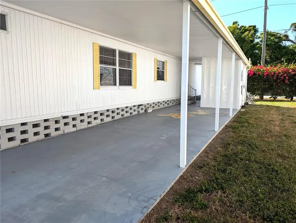a view of a backyard of the house