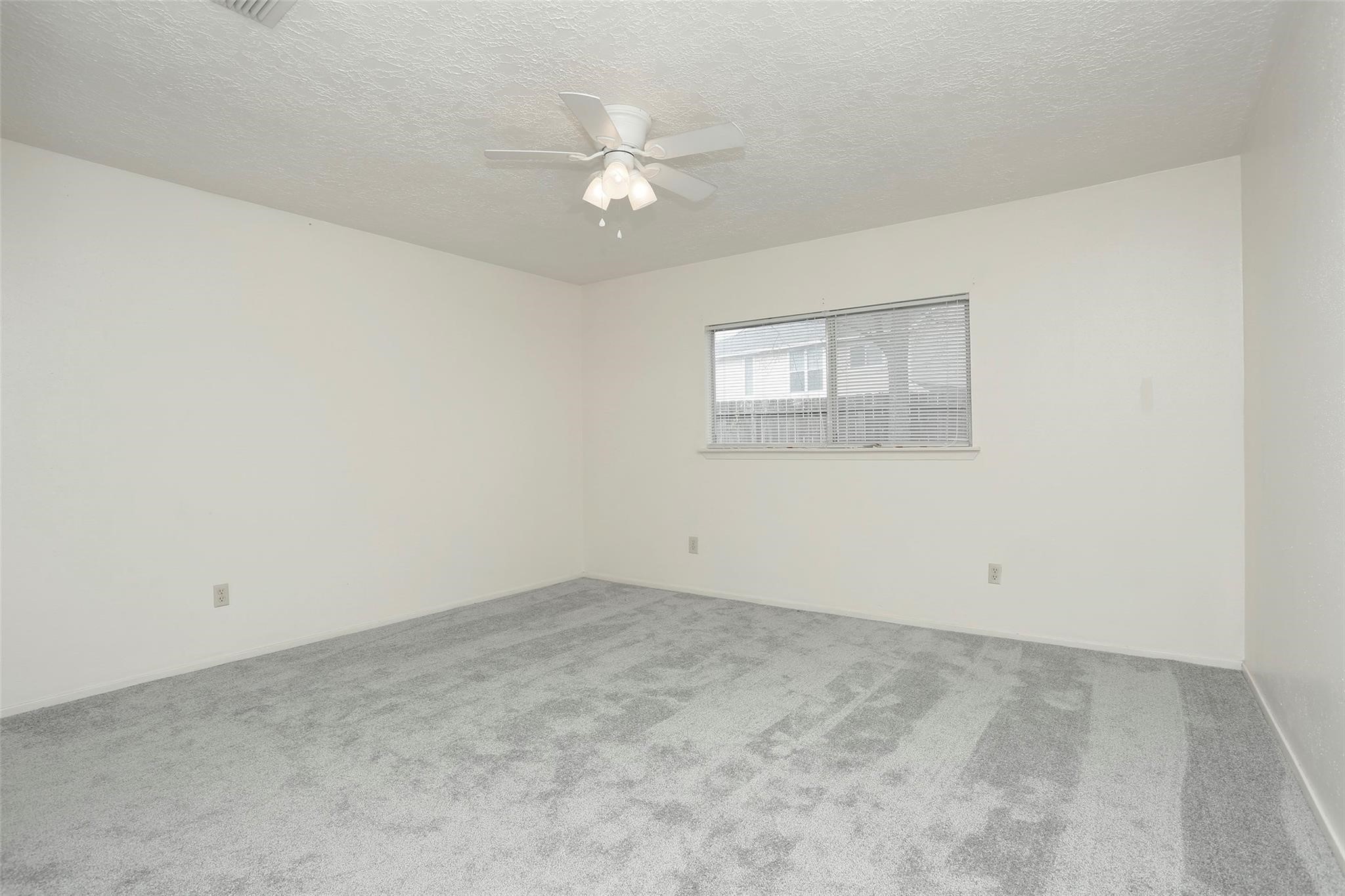 1418 Crawley Court Channelview, TX 77530 - Photo 11 of 23 an empty room with a chandelier fan