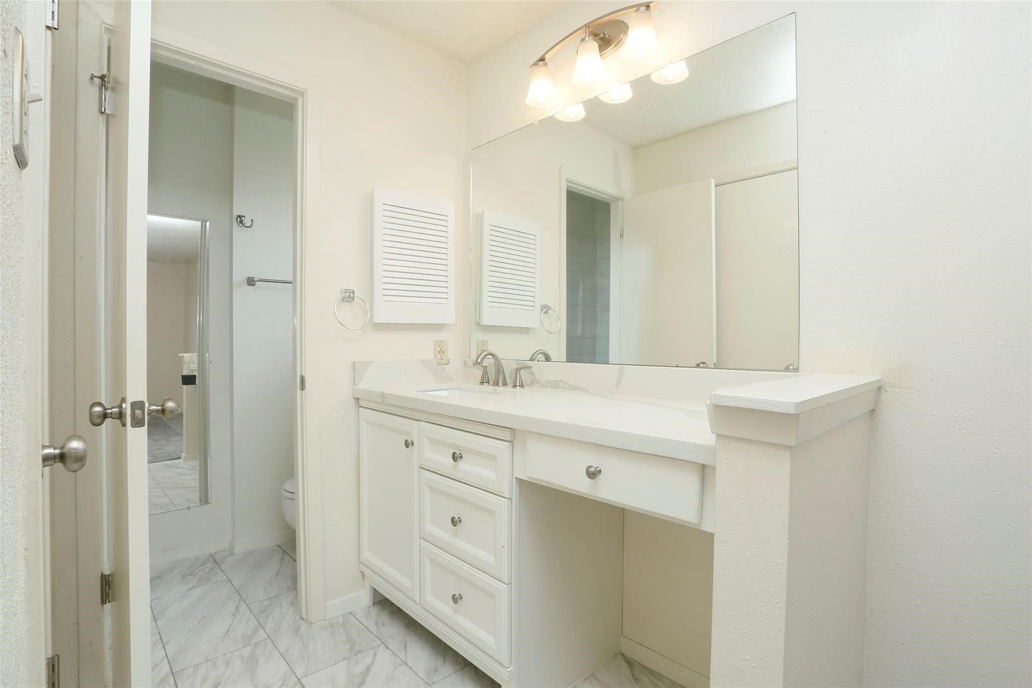 1418 Crawley Court Channelview, TX 77530 - Photo 14 of 23 a bathroom with a granite countertop sink mirror and double