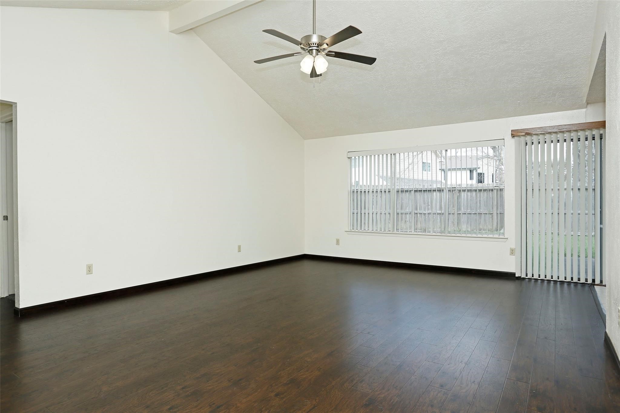 1418 Crawley Court Channelview, TX 77530 - Photo 3 of 23 wooden floor in an empty room with a window