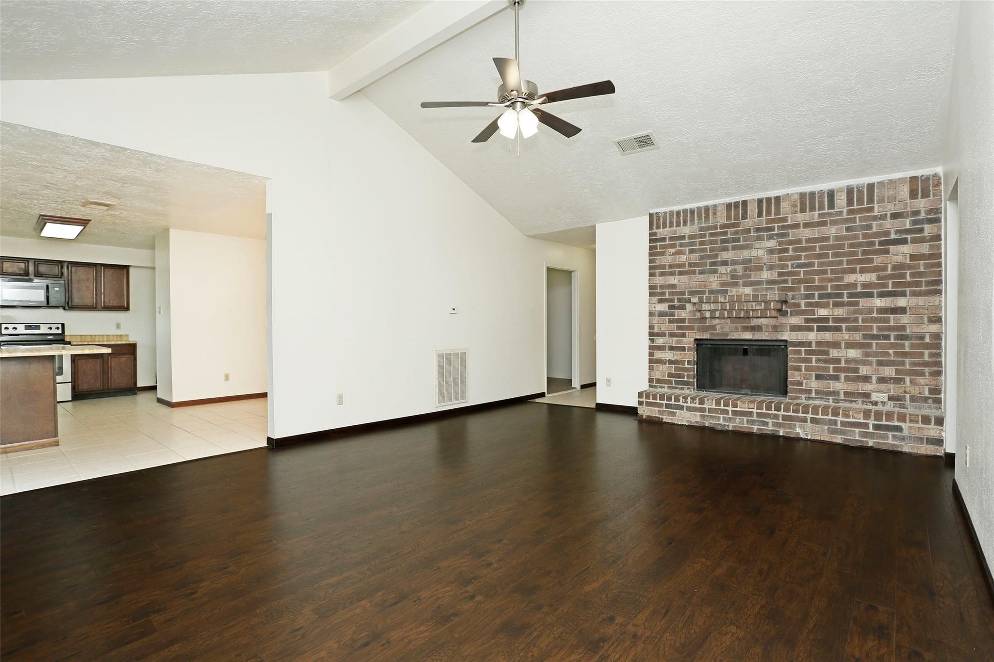 1418 Crawley Court Channelview, TX 77530 - Photo 5 of 23 a view of an empty room with a fireplace and a window