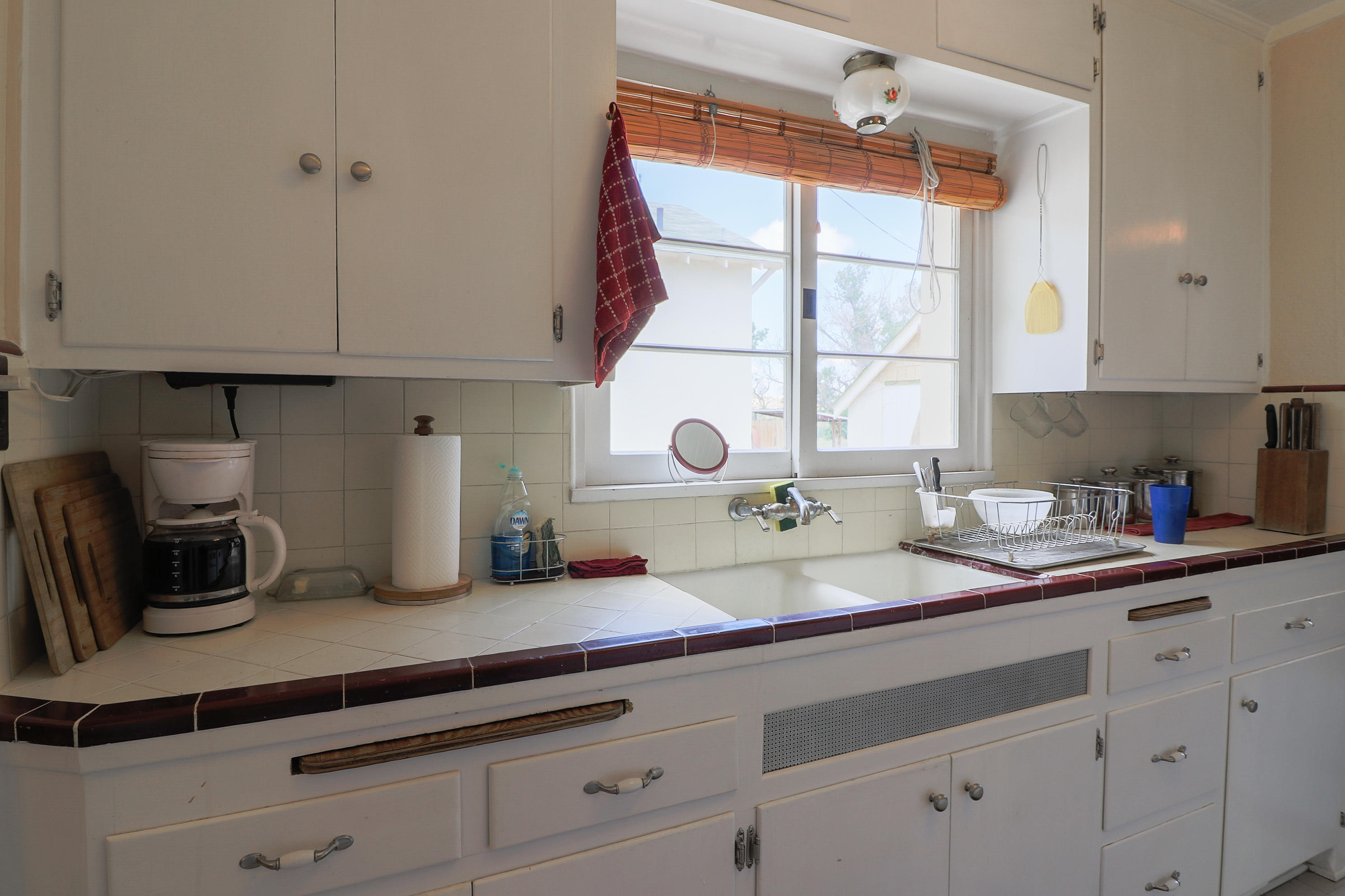 30666 Valyermo Road Llano, CA 93544 - Photo 79 of 88 a kitchen with granite countertop a sink and cabinets