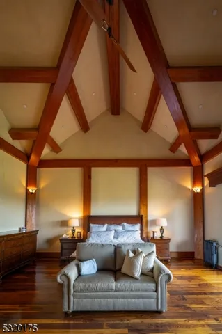 a living room with fireplace furniture and a large window