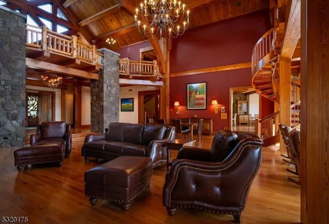 a view of a cafe with table and chairs with wooden floor and fence