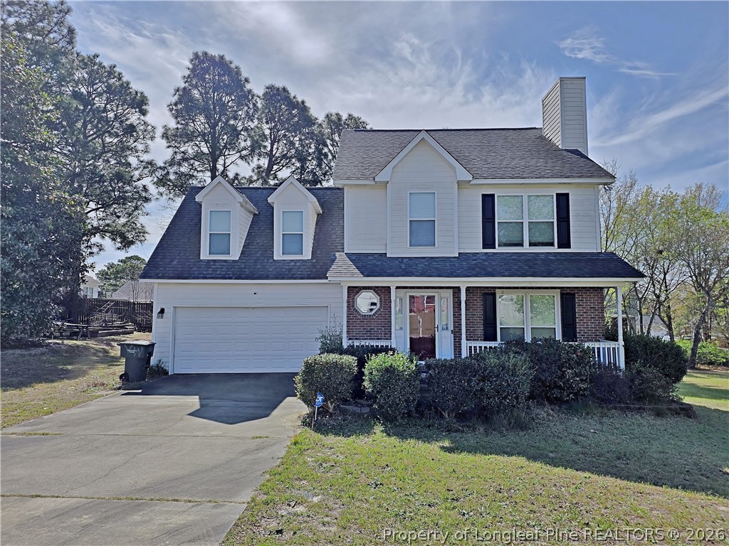 5218 Pringle Way Hope Mills, NC 28348 - Photo 36 of 43 a front view of a house with a yard and garage