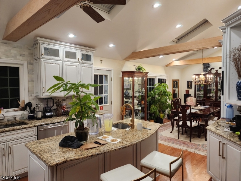 a dining room with furniture and potted plant