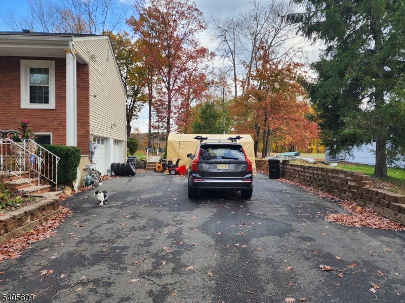 342 Diamond Spring Road Denville, NJ 07834 - Photo 9 of 9 a view of a house with truck parked on a road