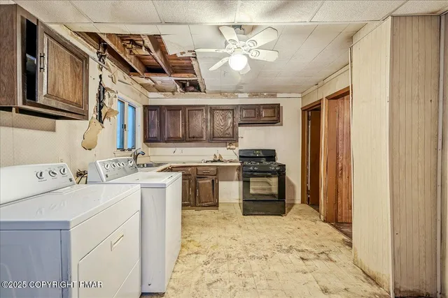 a kitchen with stainless steel appliances granite countertop a sink and cabinets