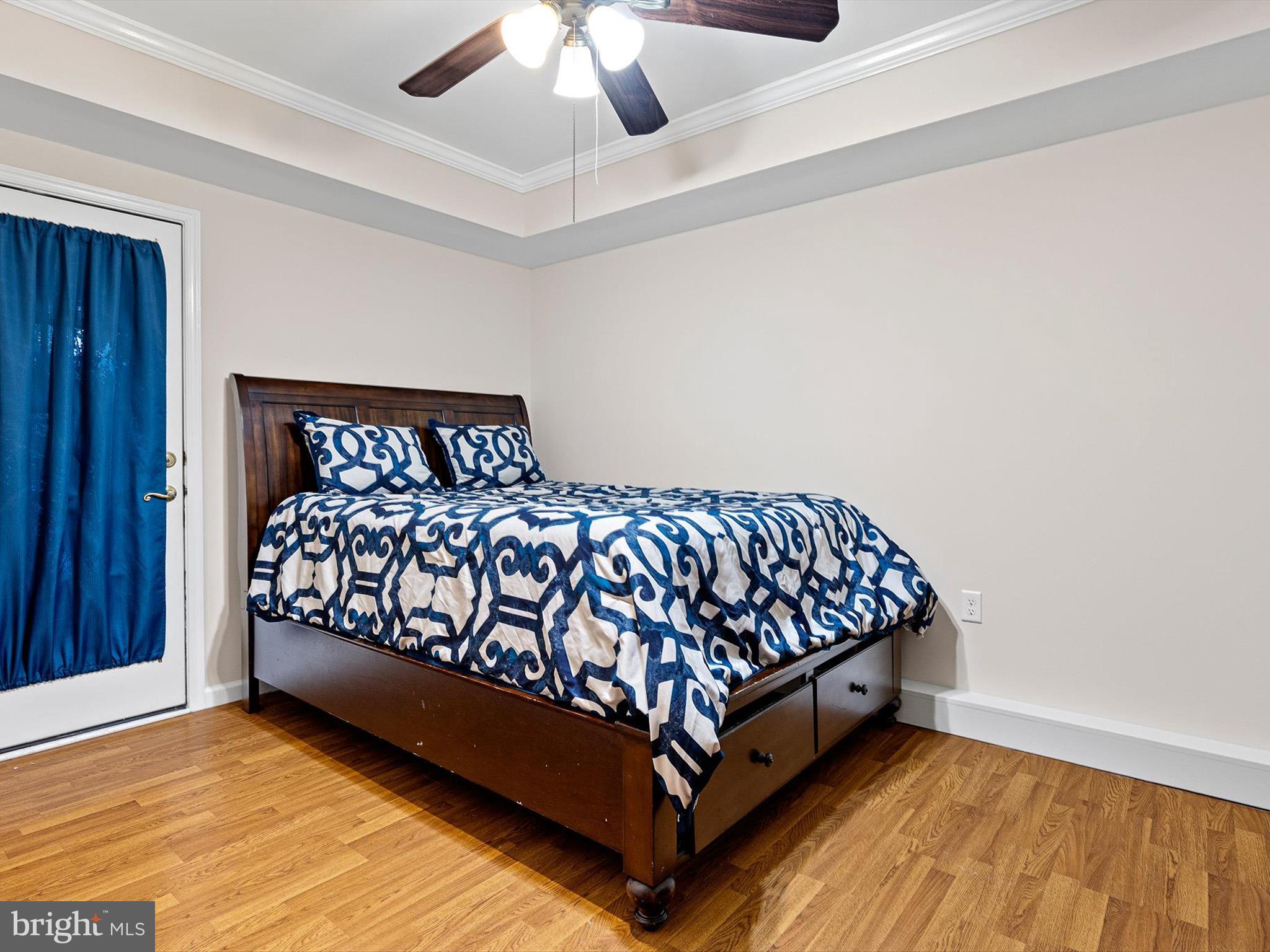 46 Westbridge Road Bear, DE 19701 - Photo 16 of 25 a bed sitting in a bedroom next to a window