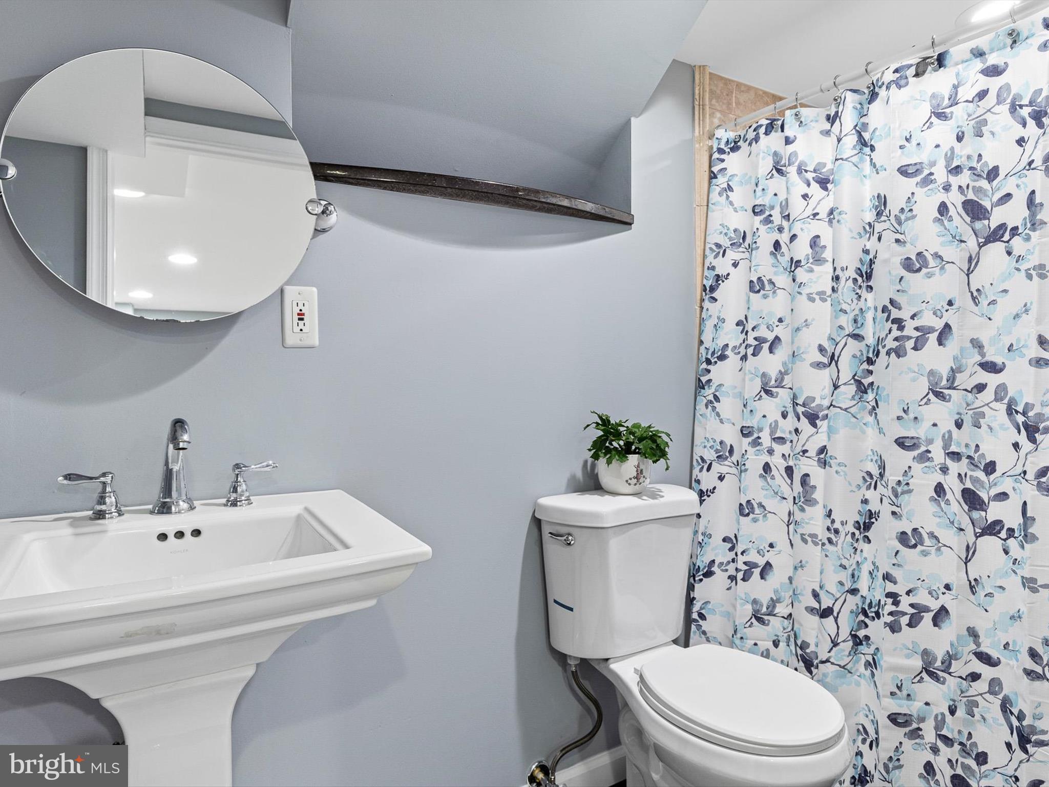 46 Westbridge Road Bear, DE 19701 - Photo 23 of 25 a bathroom with a sink toilet and mirror