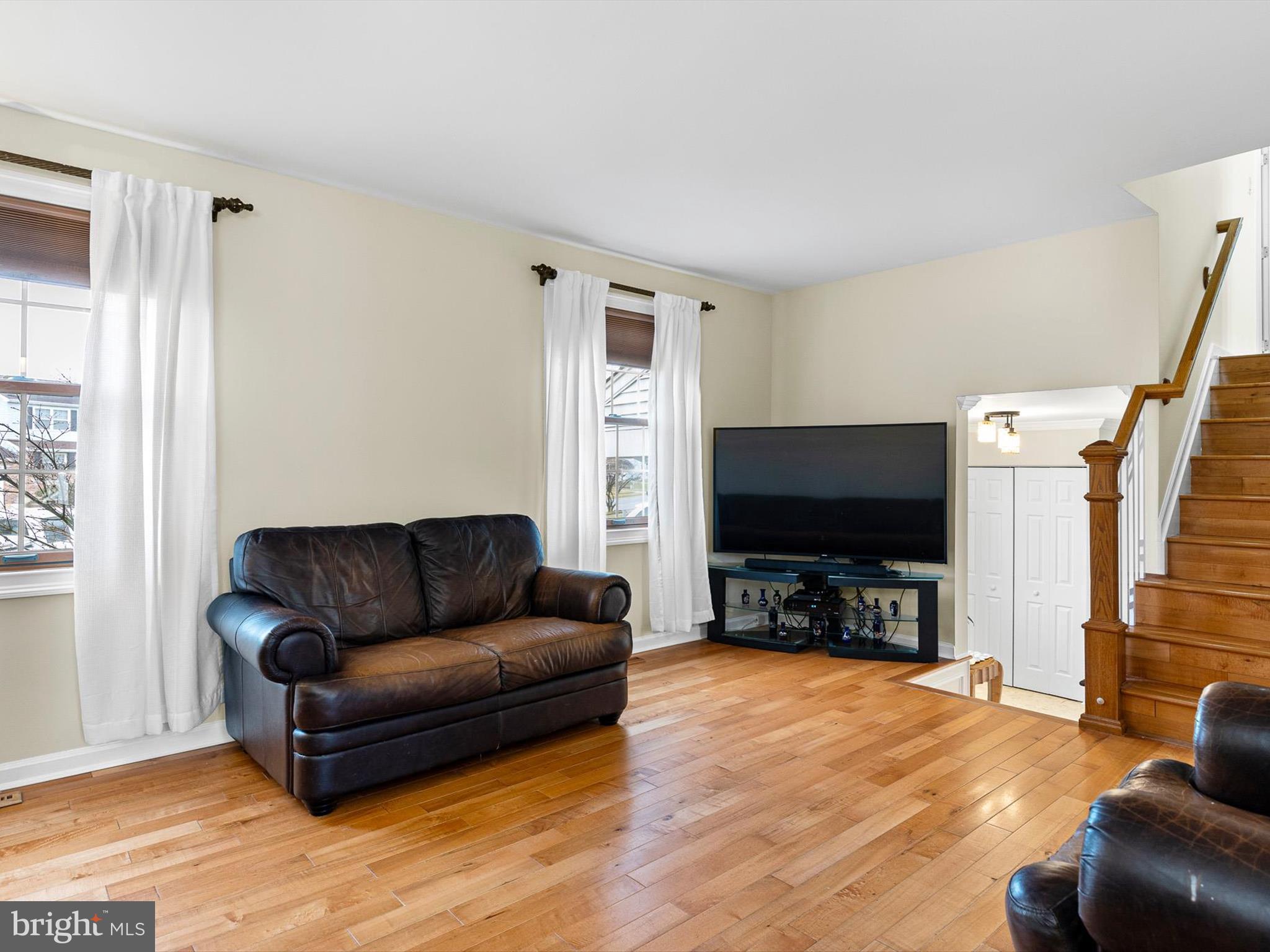 46 Westbridge Road Bear, DE 19701 - Photo 4 of 25 a living room with furniture and a flat screen tv