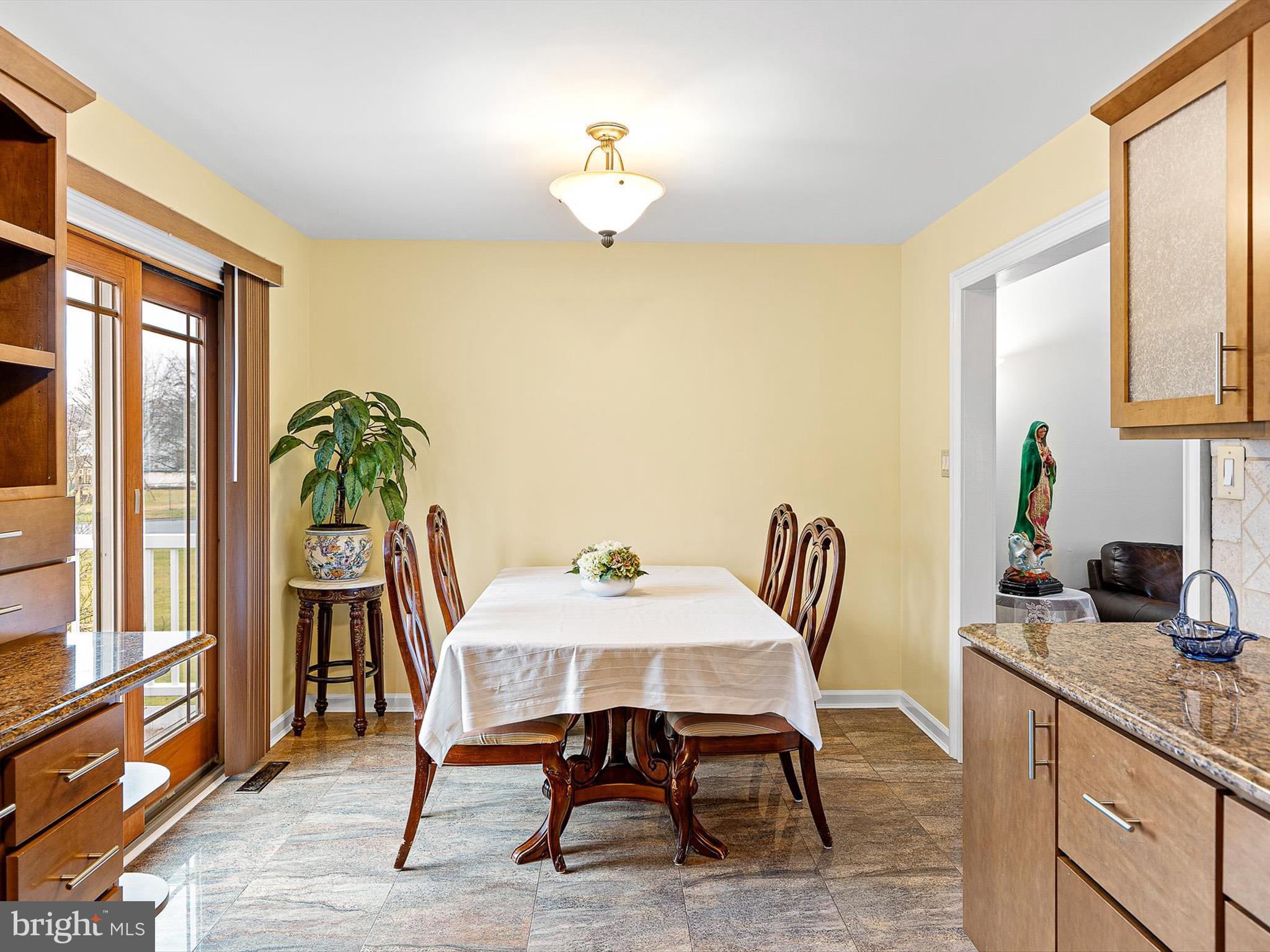 46 Westbridge Road Bear, DE 19701 - Photo 8 of 25 a view of a dining room with furniture and a window