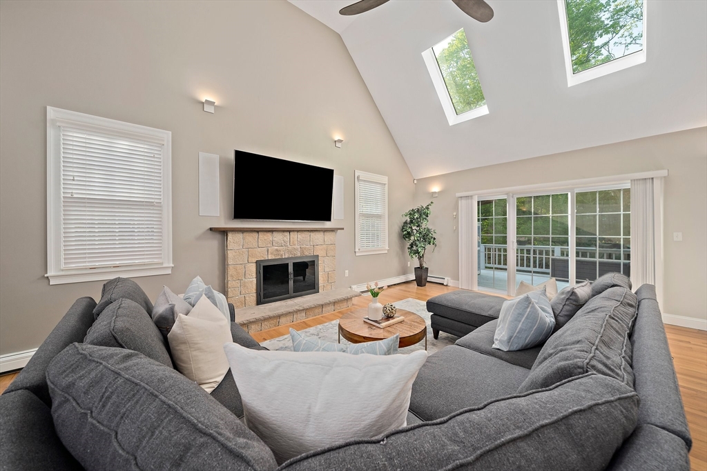 100 York Brook Road Canton, MA 02021 - Photo 15 of 42 a living room with furniture a fireplace and a flat screen tv