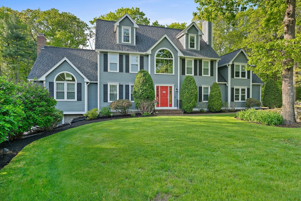 100 York Brook Road Canton, MA 02021 - Photo 2 of 42 a front view of a house with a yard and trees