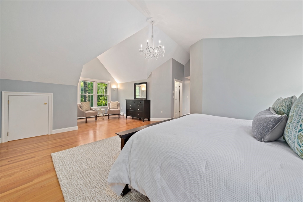 100 York Brook Road Canton, MA 02021 - Photo 24 of 42 a spacious bedroom with a bed and wooden floor