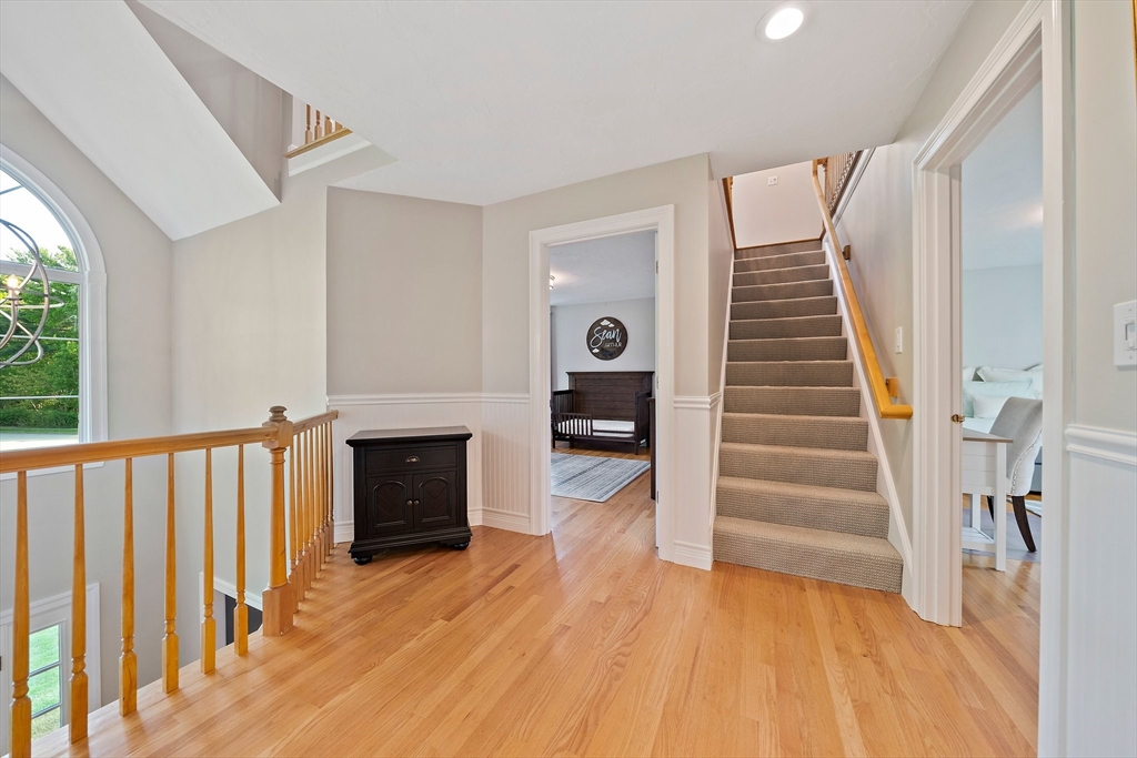 100 York Brook Road Canton, MA 02021 - Photo 32 of 42 a view of a livingroom with wooden floor and fireplace