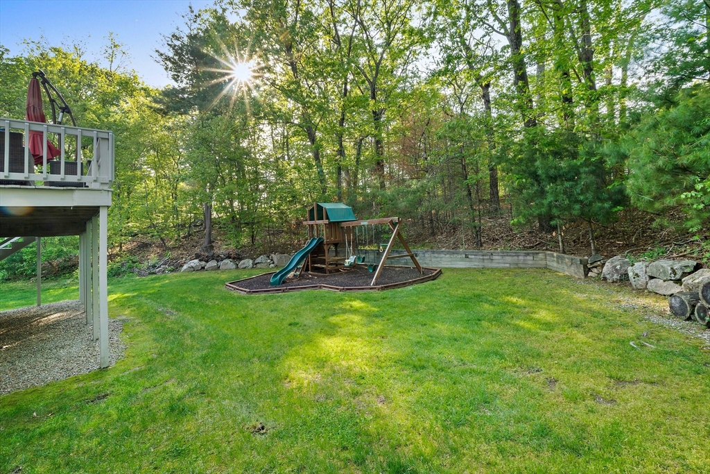 100 York Brook Road Canton, MA 02021 - Photo 38 of 42 a view of a backyard with table and chairs and potted plants