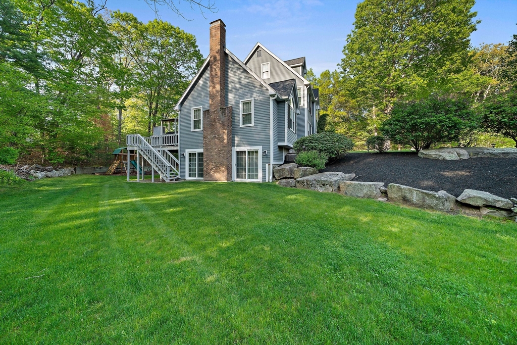 100 York Brook Road Canton, MA 02021 - Photo 39 of 42 a view of a house with a big yard and large trees